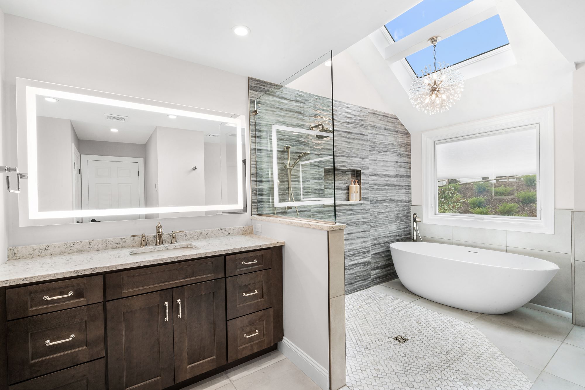 Bathroom remodel with soaking tub in shower with large windows and chandelier and lots of light in  North Caldwell, NJ