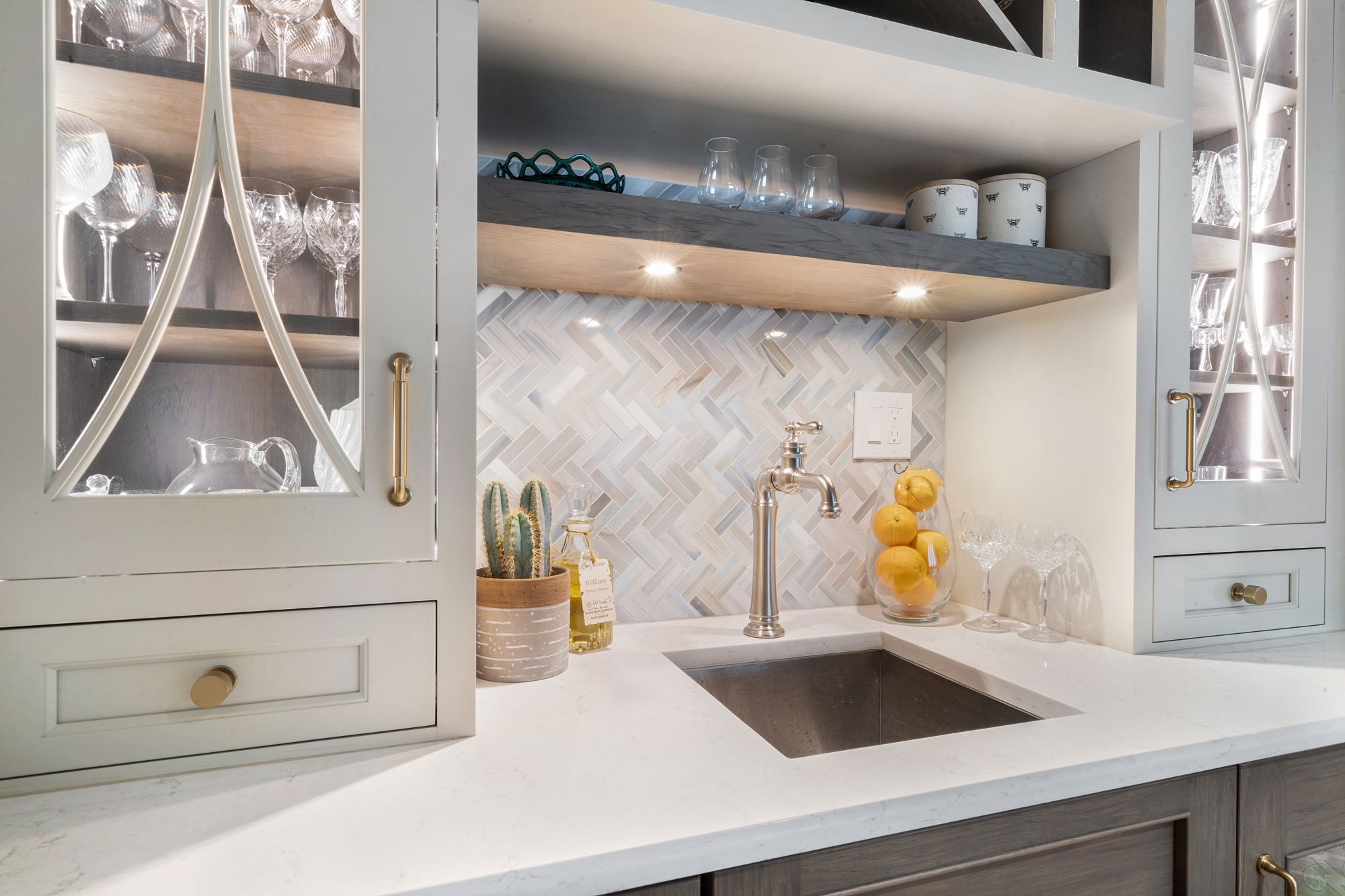 Wetbar with glass cabinets and wine and liquor storage gray color and tile backsplash in North Caldwell, NJ