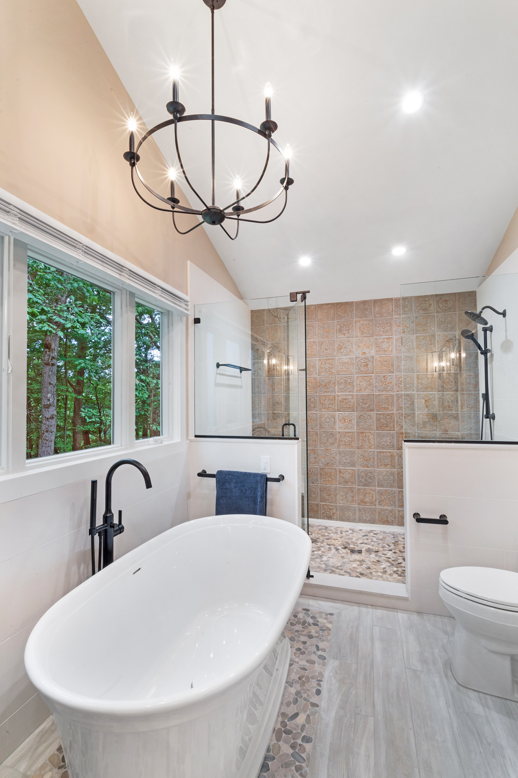 Master bathroom remodel soaking tub, wall paneling, walk in shower with cherry dusk shaker door legacy crafter cabinets, silestone desert silver suede countertops, kohler Santa rosa Toilet, black and white tile in Chester, NJ renovated by JMC Home Improvement Specialists