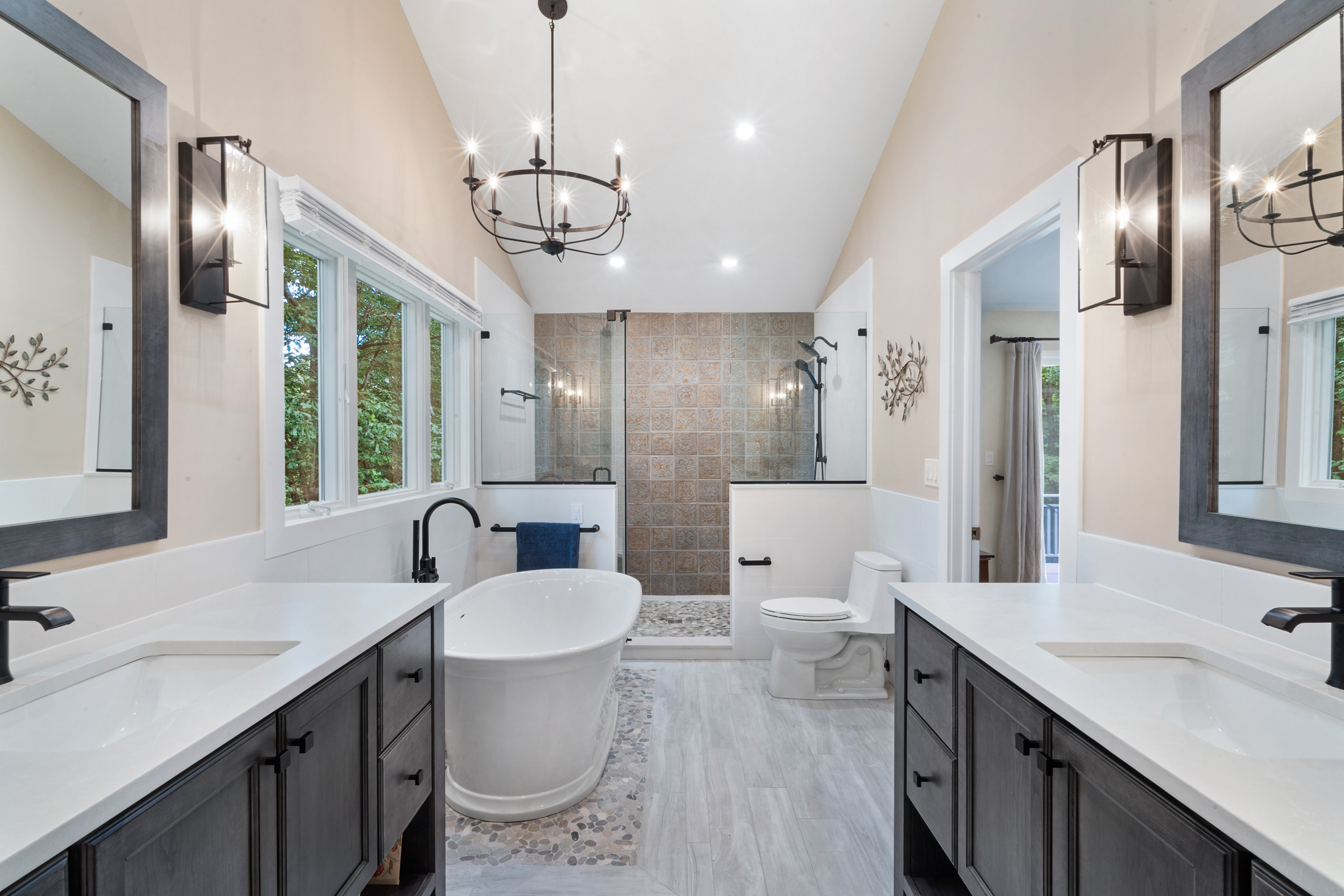 Master bathroom remodel soaking tub, wall paneling, walk in shower with cherry dusk shaker door legacy crafter cabinets, silestone desert silver suede countertops, kohler Santa rosa Toilet, black and white tile in Chester, NJ renovated by JMC Home Improvement Specialists