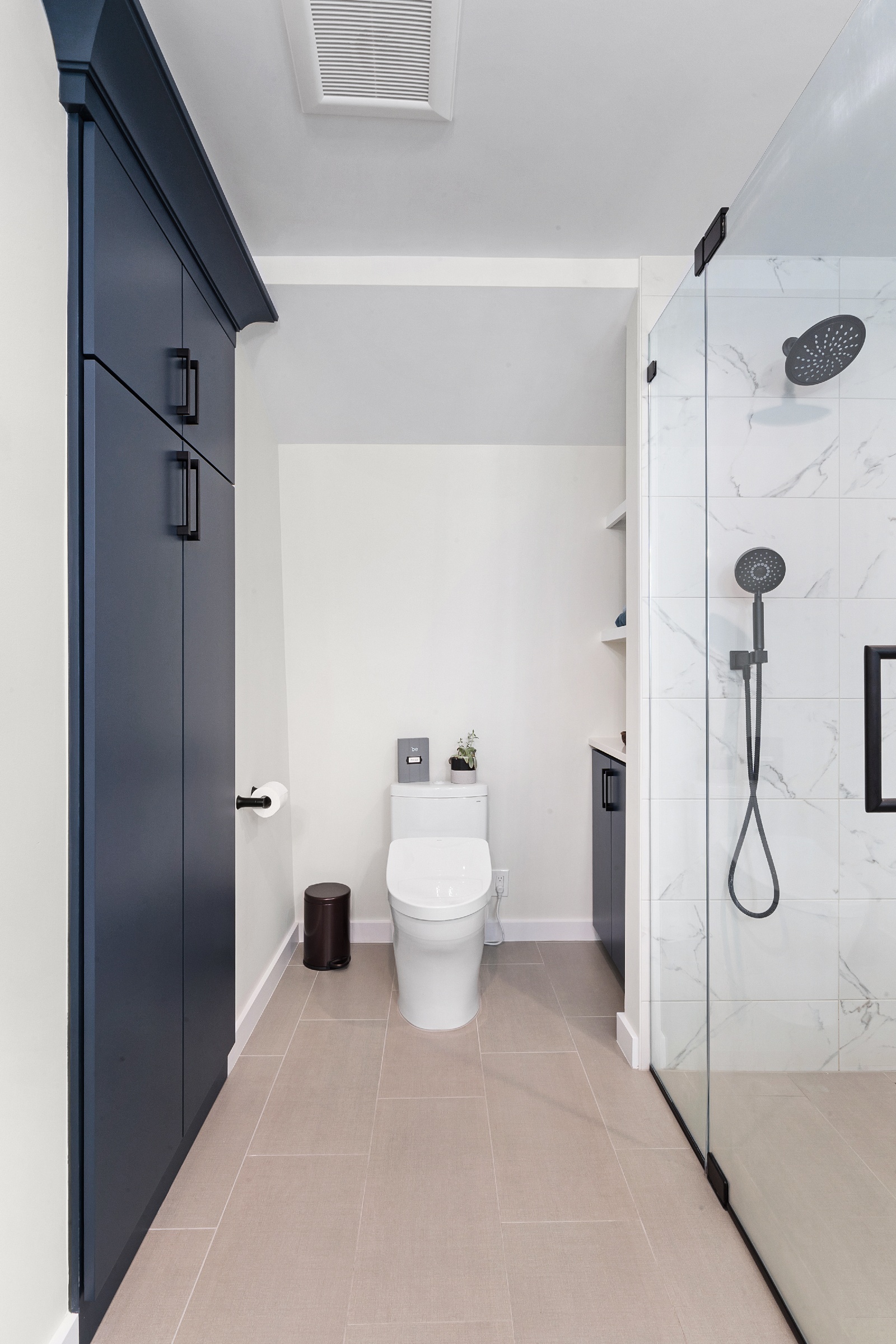 Master bathroom remodel with heated floors, 21x24 tiles and Moen fixtures in Flanders, NJ renovated by JMC Home Improvement Specialists